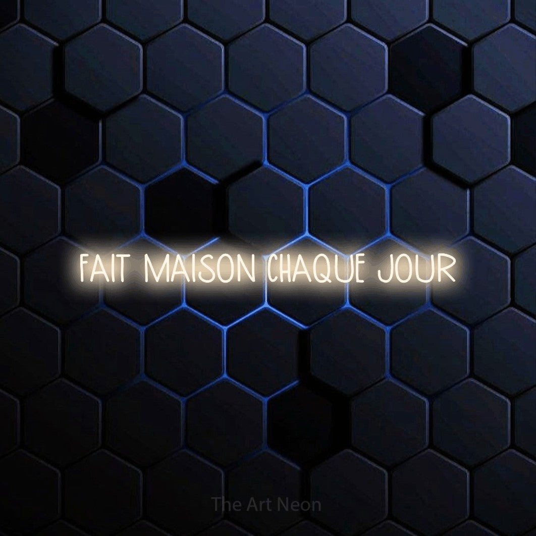 “Fait maison chaque jour” LED neon sign in warm white, with narrow hand-drawn lettering, shown against a dark blue honeycomb pattern.
