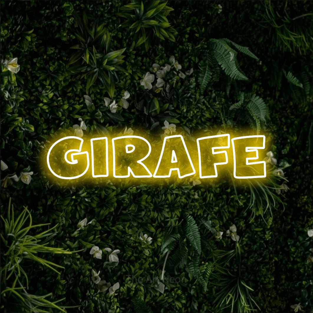 “Girafe” LED neon sign in yellow, with wide lettering with irregular outlines, shown against a dense green plant wall.