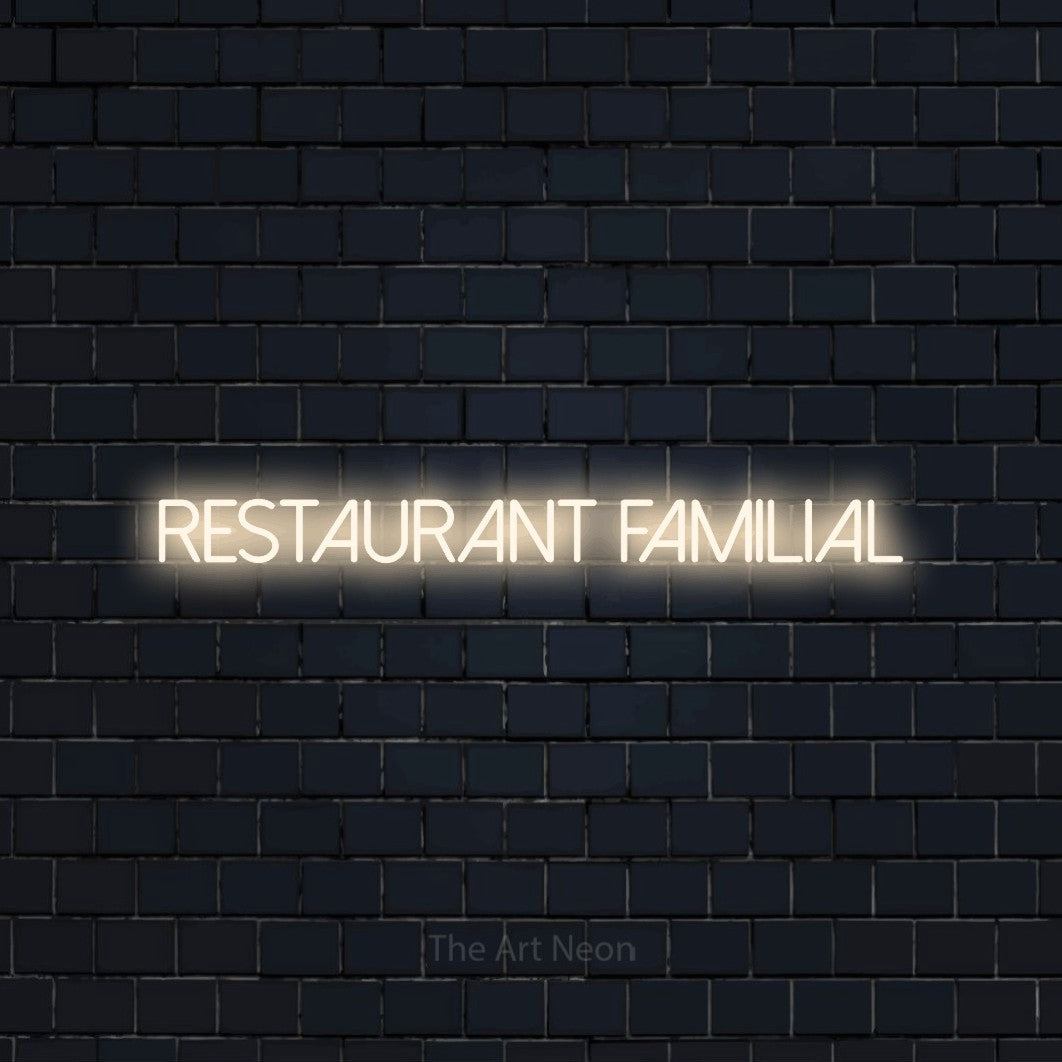 “Restaurant familial” LED neon sign in warm white, with thin sans-serif lettering, shown against a dark navy brick wall.