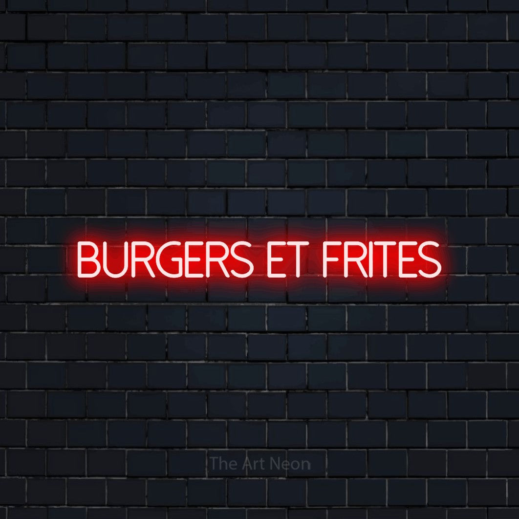 “Burgers et frites” LED neon sign in red, with thin sans-serif lettering, shown against a dark navy brick wall.