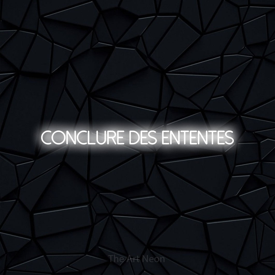 “Conclure des ententes” LED neon sign in cool white, with thin sans-serif lettering, shown against a black polygonal surface.