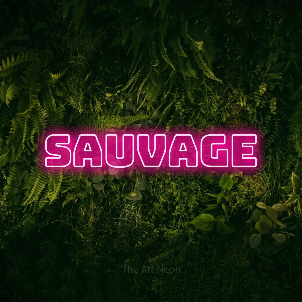 “Sauvage” LED neon sign in hot pink, with bold outline lettering, shown against a dark moss and forest backdrop.