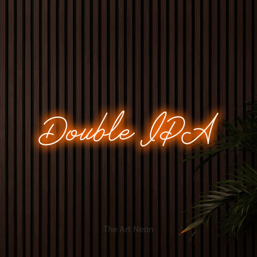 “Double IPA” LED neon sign in orange, with cursive lettering, shown against dark wooden wall slats.
