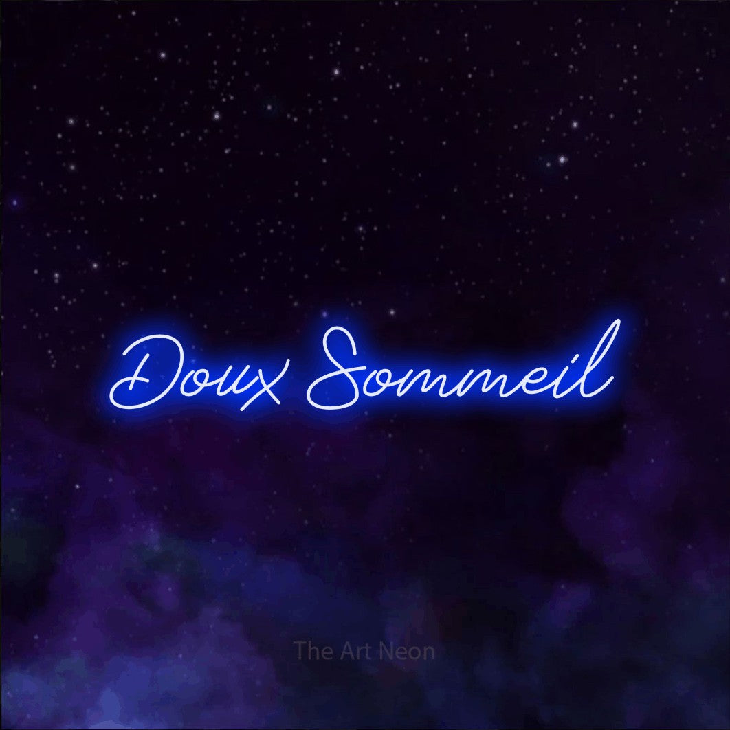 “Doux sommeil” LED neon sign in blue, with cursive lettering, shown against a purple galaxy backdrop.