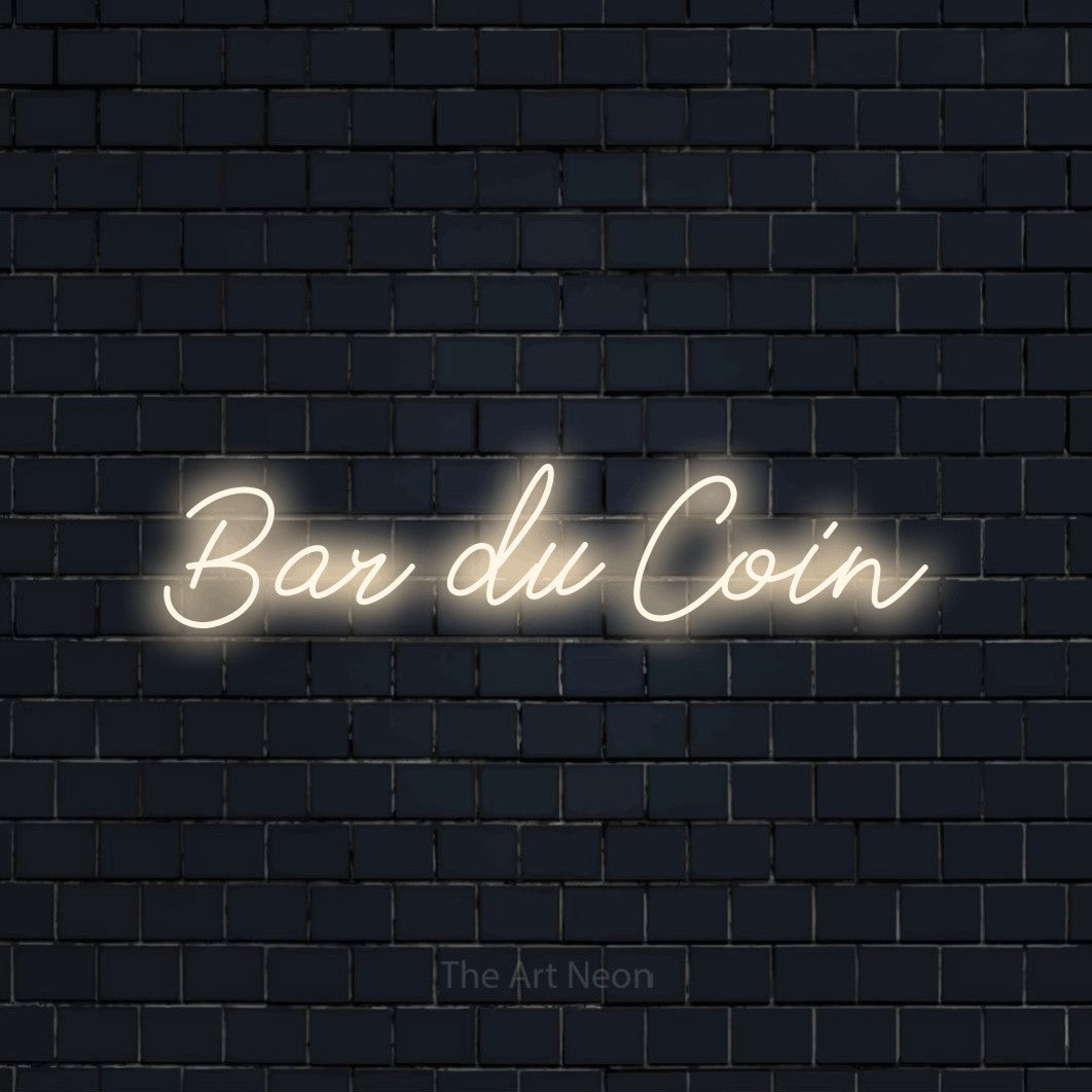 “Bar du coin” LED neon sign in warm white, with cursive lettering, shown against a dark navy brick wall.