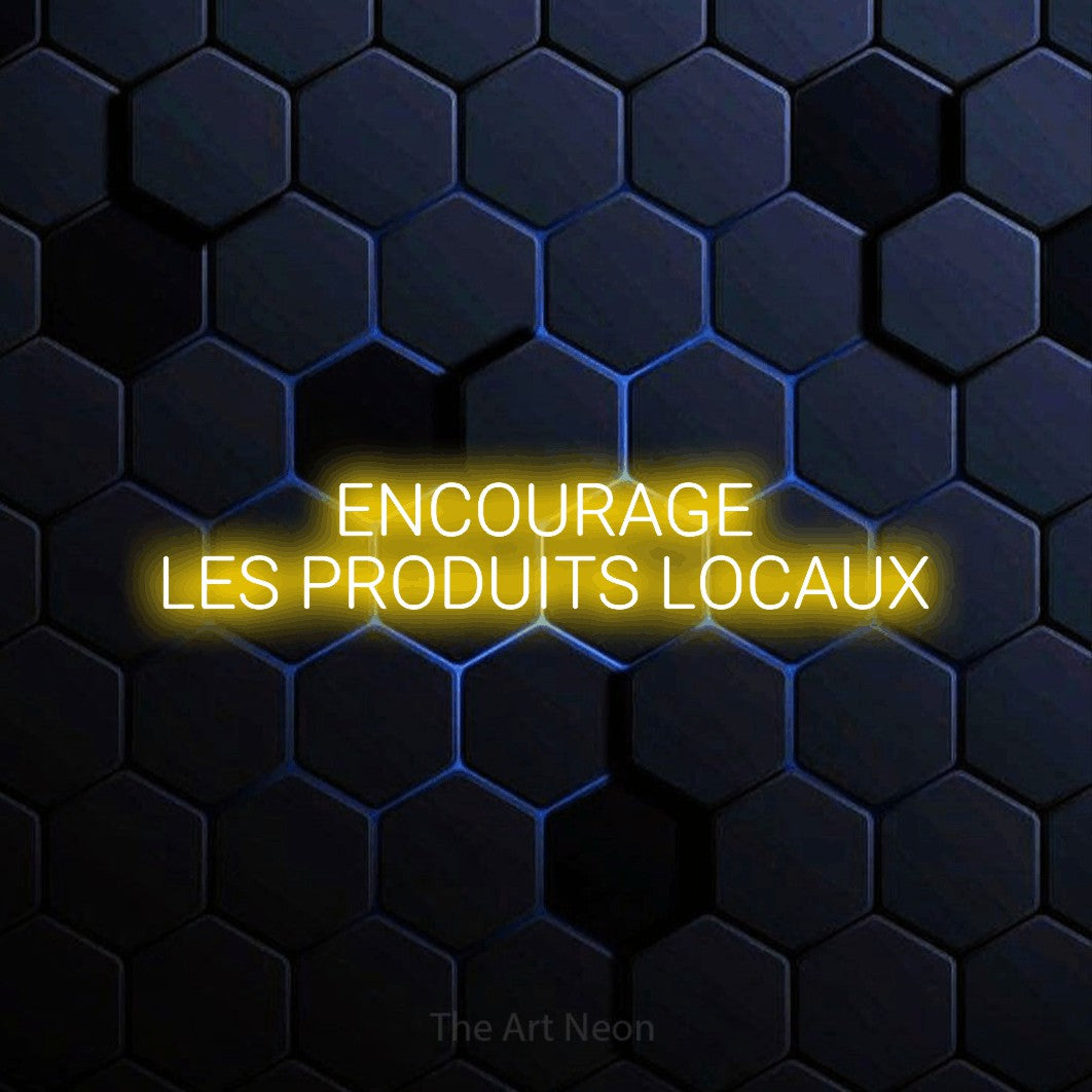 “Encourage les produits locaux” LED neon sign in yellow, with rounded sans-serif lettering across 2 lines, shown against a dark blue honeycomb pattern.