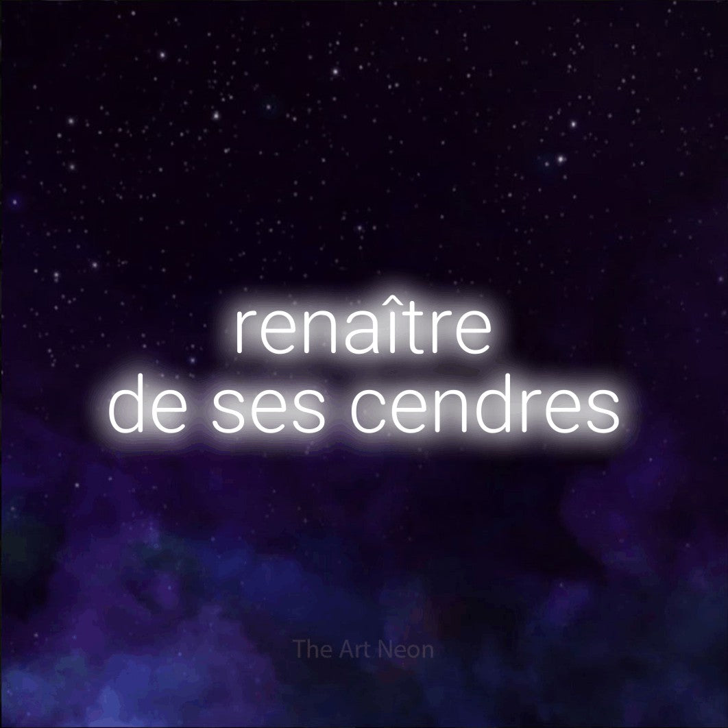 “Renaître de ses cendres” LED neon sign in cool white, with rounded sans-serif lettering across 2 lines, shown against a purple galaxy backdrop.