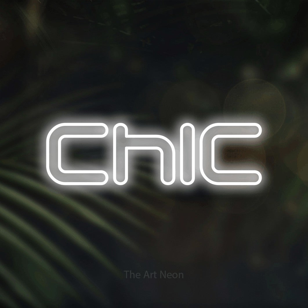“Chic” LED neon sign in cool white, with futuristic double-line lettering, shown against a blurred palm and bokeh-light backdrop.