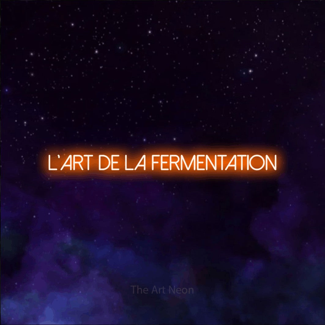 “L'art de la fermentation” LED neon sign in orange, with thin sans-serif lettering, shown against a purple galaxy backdrop.