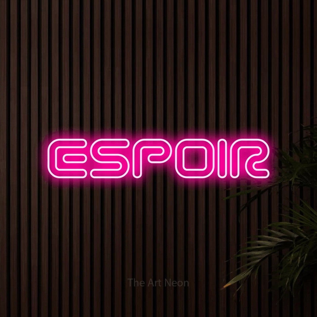 “Espoir” LED neon sign in hot pink, with futuristic double-line lettering, shown against dark wooden wall slats.