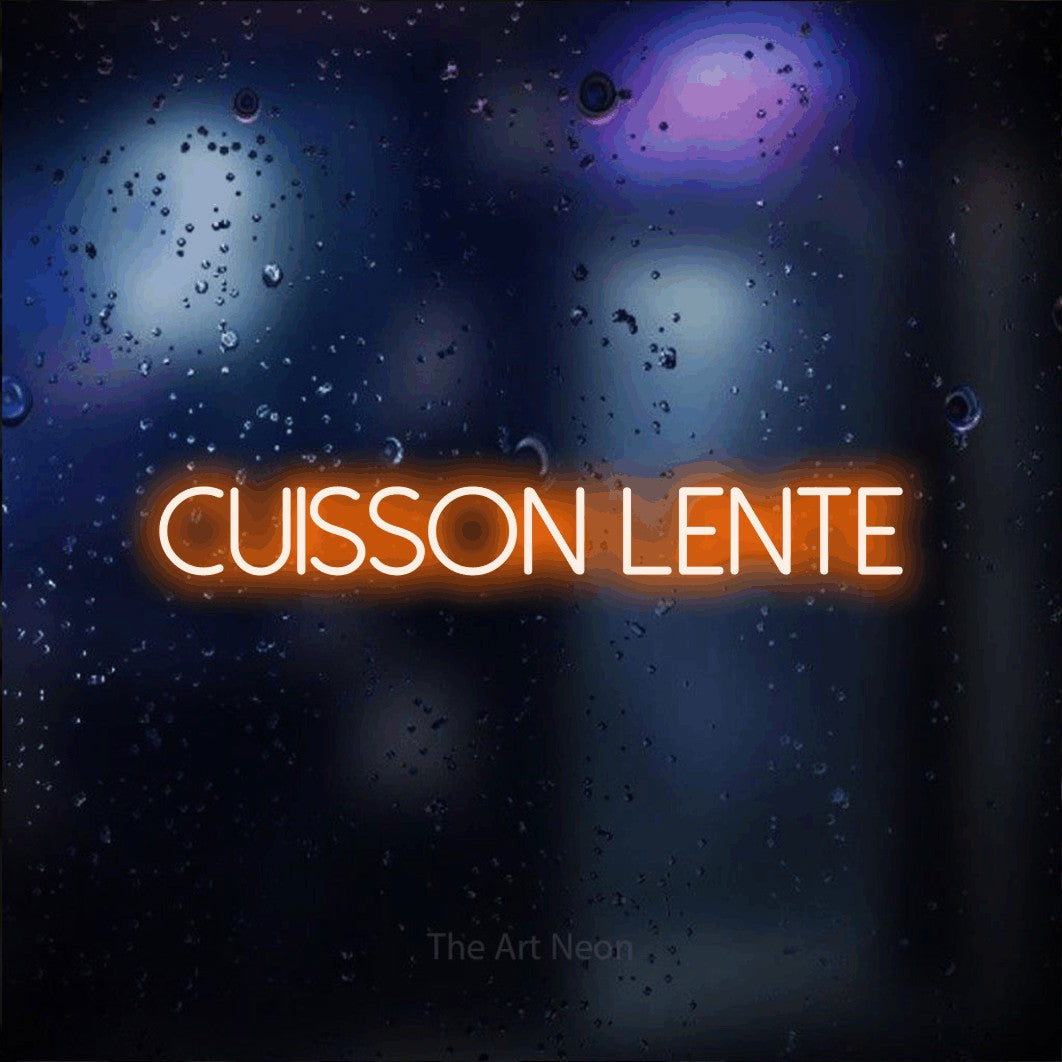 “Cuisson lente” LED neon sign in orange, with thin sans-serif lettering, shown against glass with blue and purple reflections.