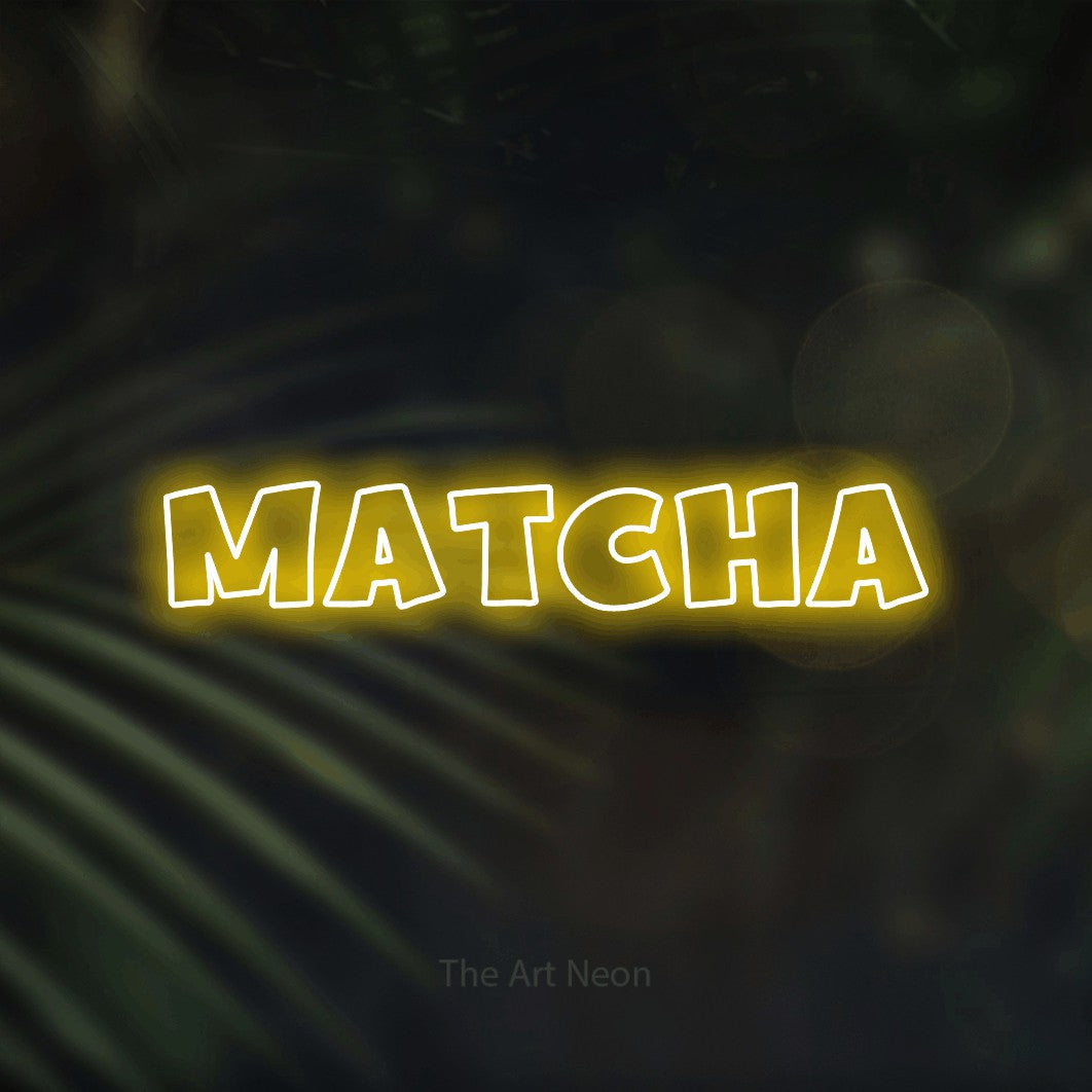 “Matcha” LED neon sign in yellow, with wide lettering with irregular outlines, shown against a blurred palm and bokeh-light backdrop.