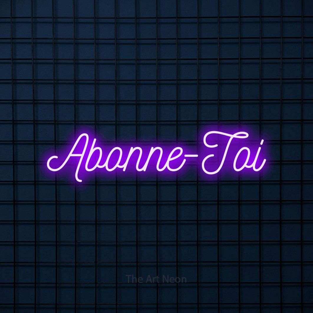 “Abonne-toi” LED neon sign in purple, with ornate cursive lettering, shown against a dark blue grid.
