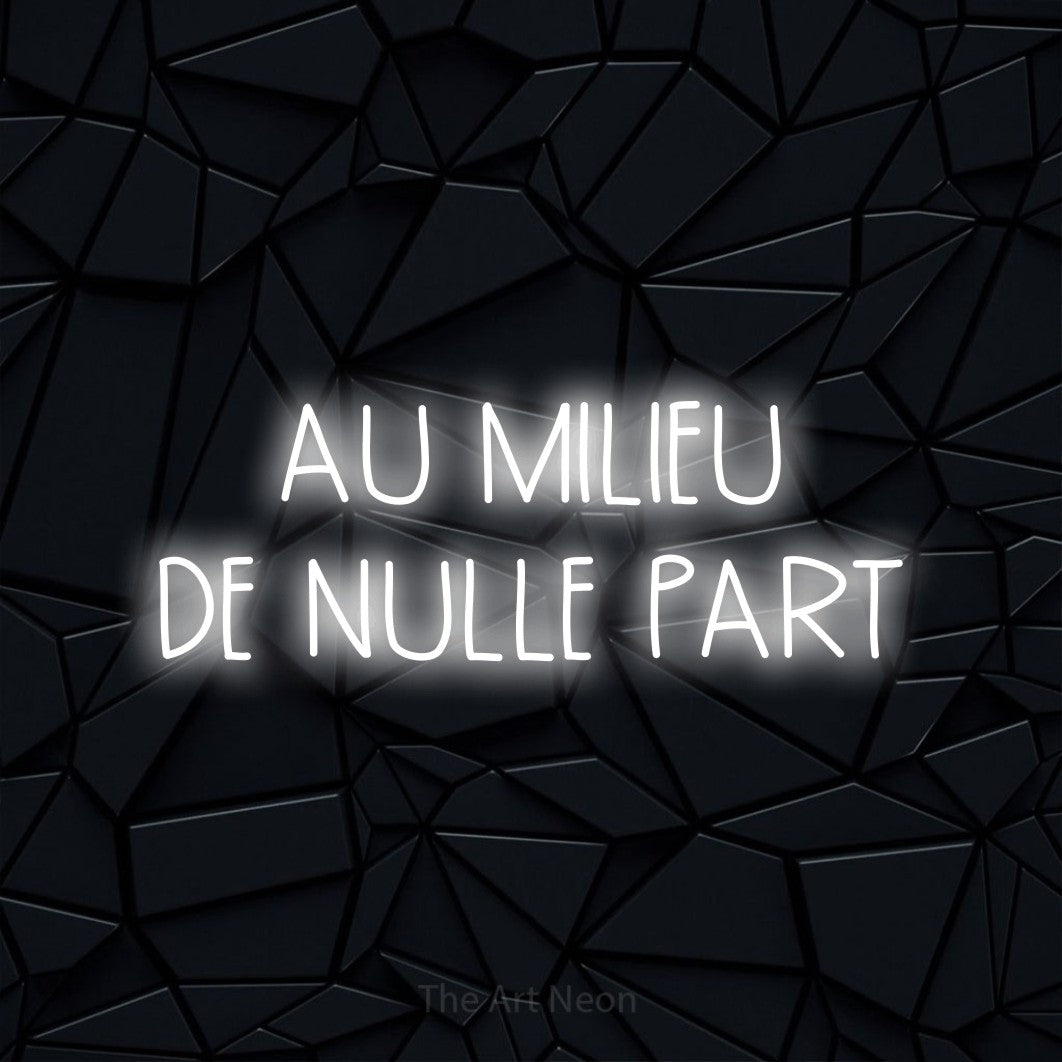“Au milieu de nulle part” LED neon sign in cool white, with narrow hand-drawn lettering across 2 lines, shown against a black polygonal surface.