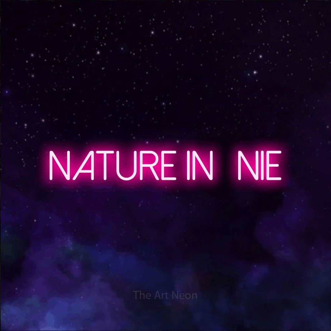 “Nature infinie” LED neon sign in hot pink, with thin sans-serif lettering, shown against a purple galaxy backdrop.