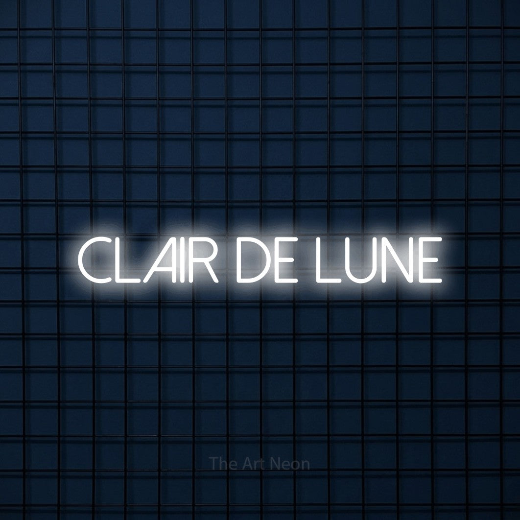“Clair de lune” LED neon sign in cool white, with thin sans-serif lettering, shown against a dark blue grid.