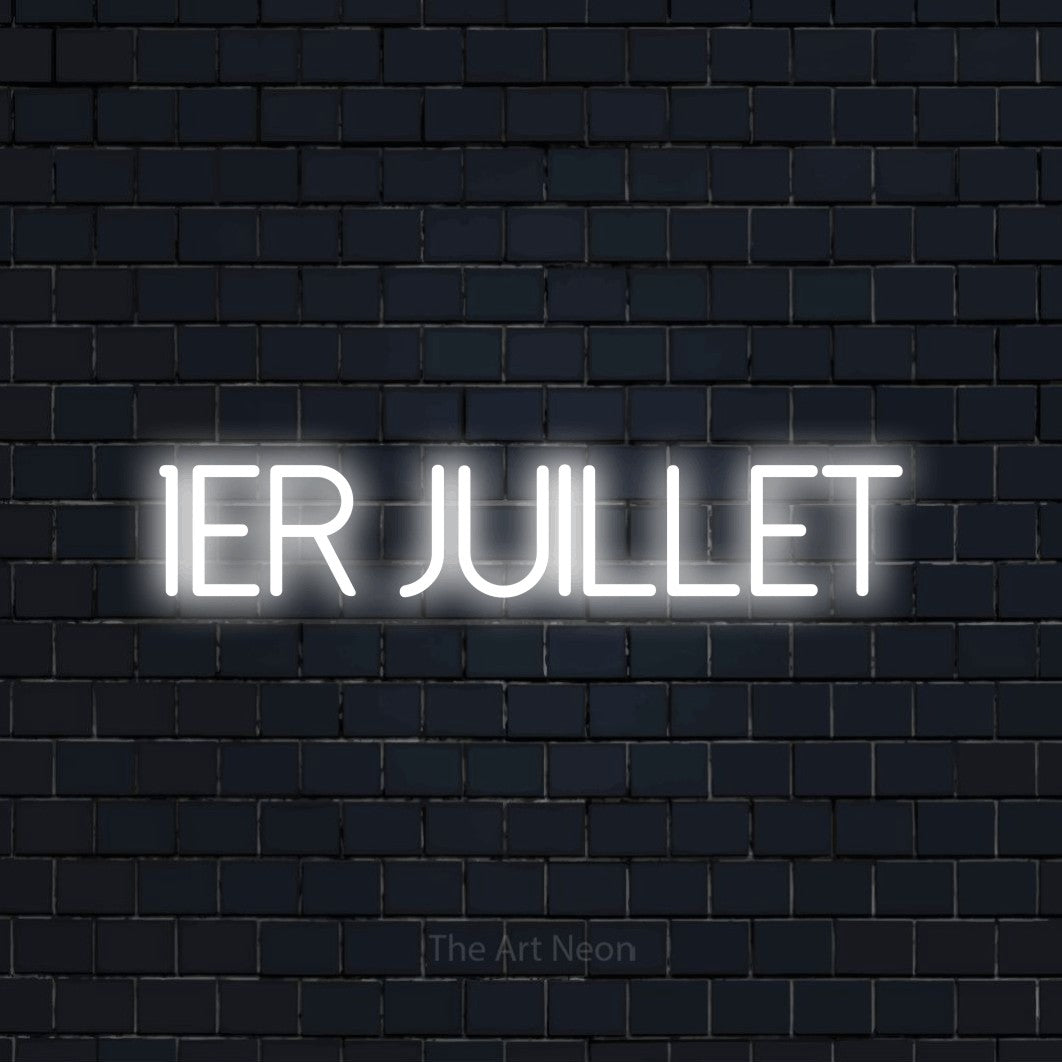 “1er juillet” LED neon sign in cool white, with thin sans-serif lettering, shown against a dark navy brick wall.