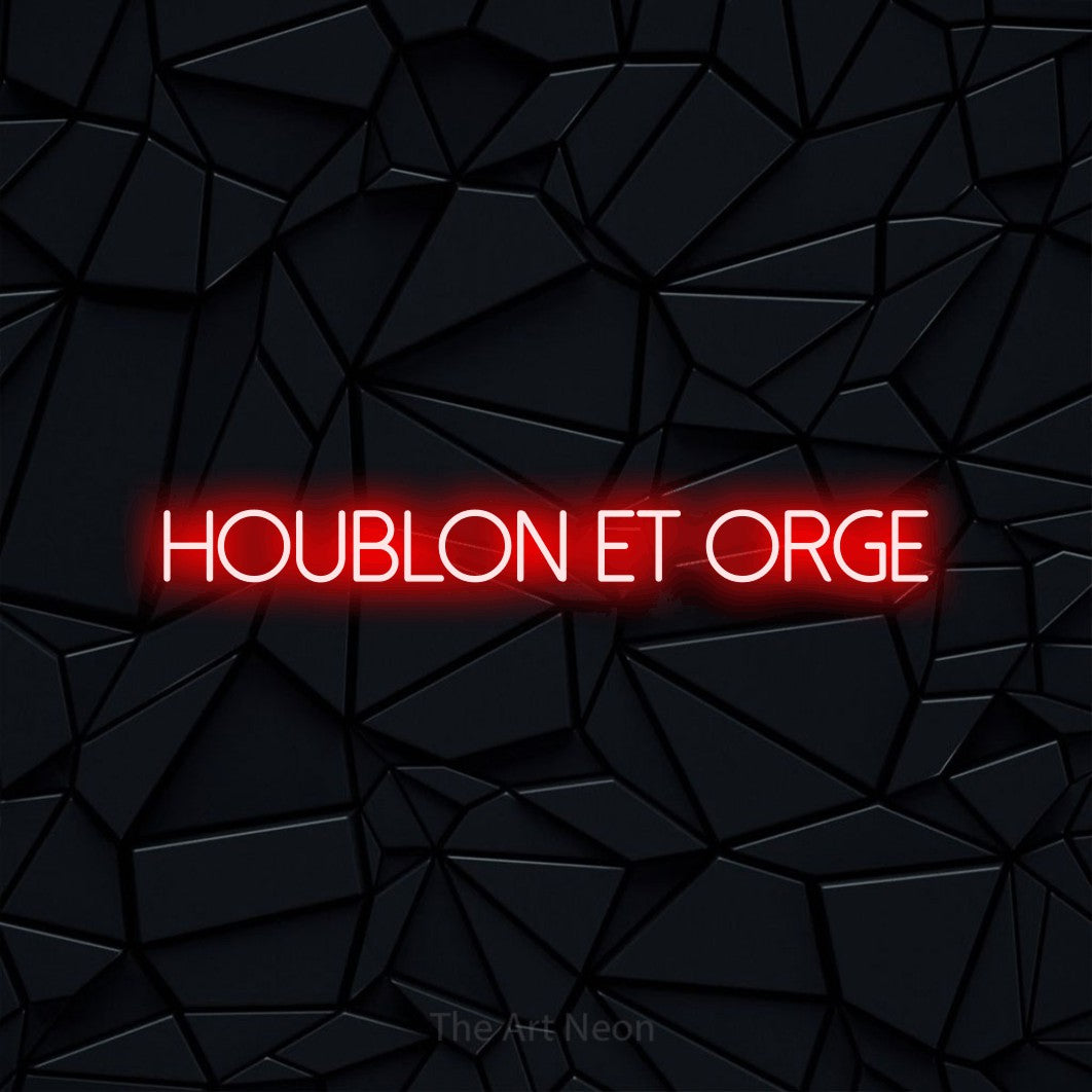 “Houblon et orge” LED neon sign in red, with thin sans-serif lettering, shown against a black polygonal surface.