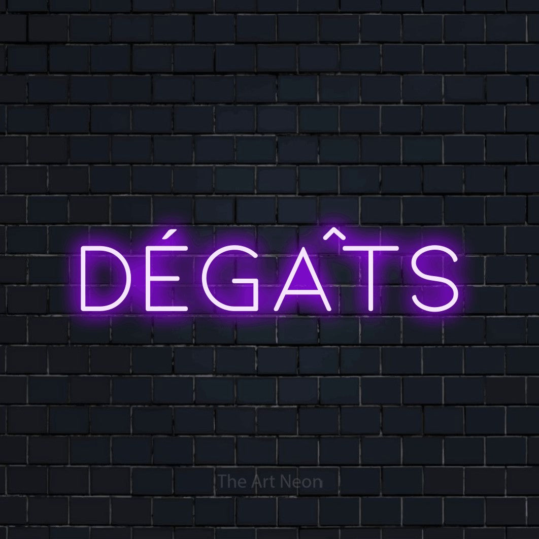 “Dégâts” LED neon sign in purple, with thin, widely spaced lettering, shown against a dark navy brick wall.