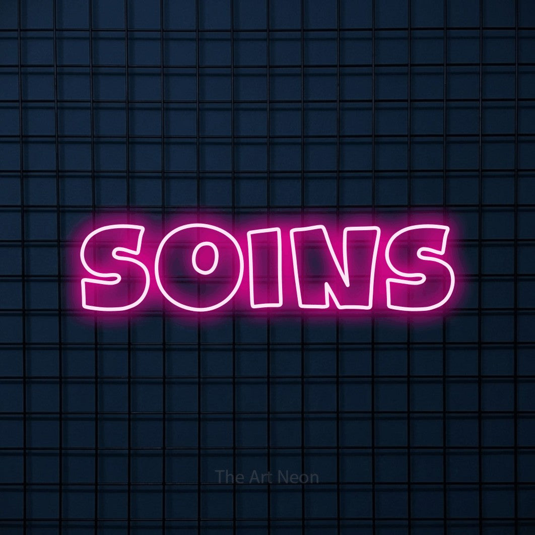 Composition en néon LED « Soins » en rose vif, en lettres larges aux contours irréguliers, mise en valeur sur une grille bleu foncé, pour un salon de beauté.