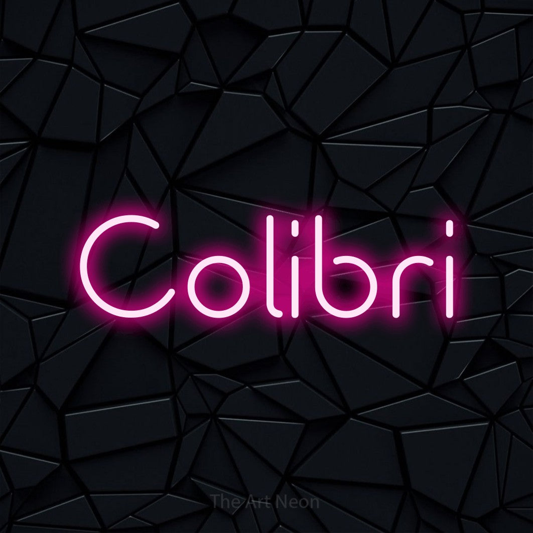 “Colibri” LED neon sign in hot pink, with stylised geometric lettering, shown against a black polygonal surface.