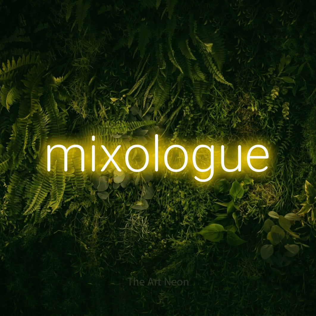 “Mixologue” LED neon sign in yellow, with rounded sans-serif lettering, shown against a dark moss and forest backdrop.