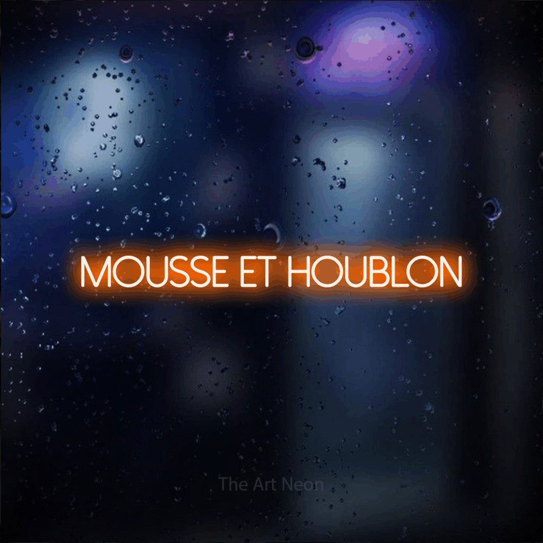 “Mousse et houblon” LED neon sign in orange, with thin sans-serif lettering, shown against glass with blue and purple reflections.