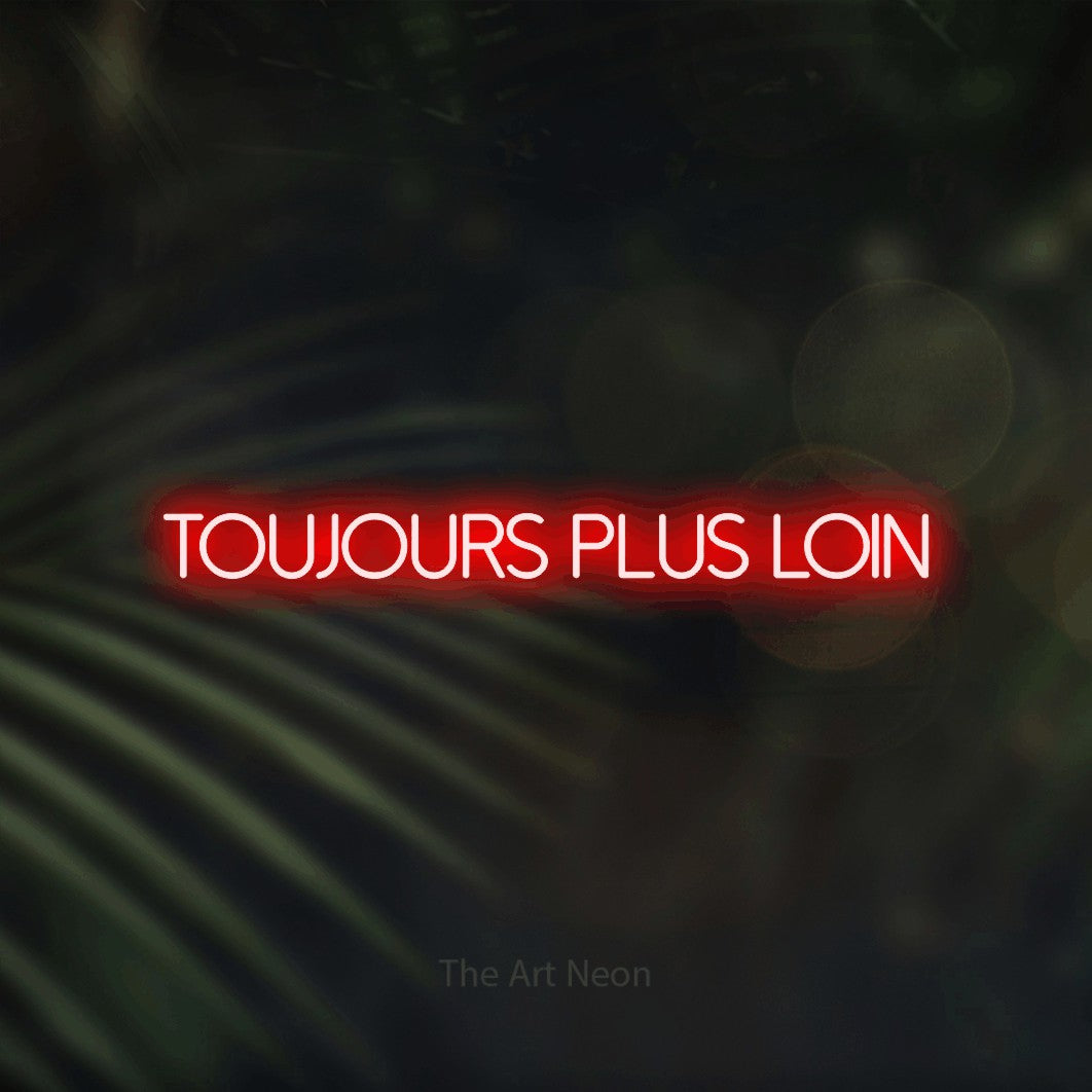 “Toujours plus loin” LED neon sign in red, with thin sans-serif lettering, shown against a blurred palm and bokeh-light backdrop.
