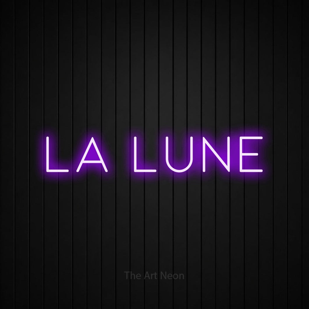 “La lune” LED neon sign in purple, with thin, widely spaced lettering, shown against black vertical wall slats.