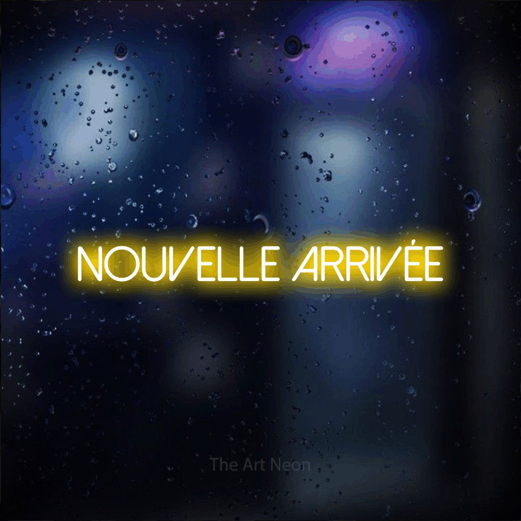 “Nouvelle arrivée” LED neon sign in yellow, with thin sans-serif lettering, shown against glass with blue and purple reflections.