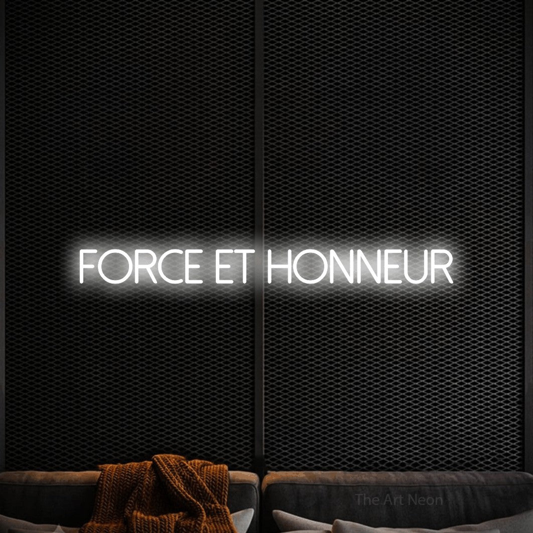 “Force et honneur” LED neon sign in cool white, with thin sans-serif lettering, shown against a modern dark-toned seating area.