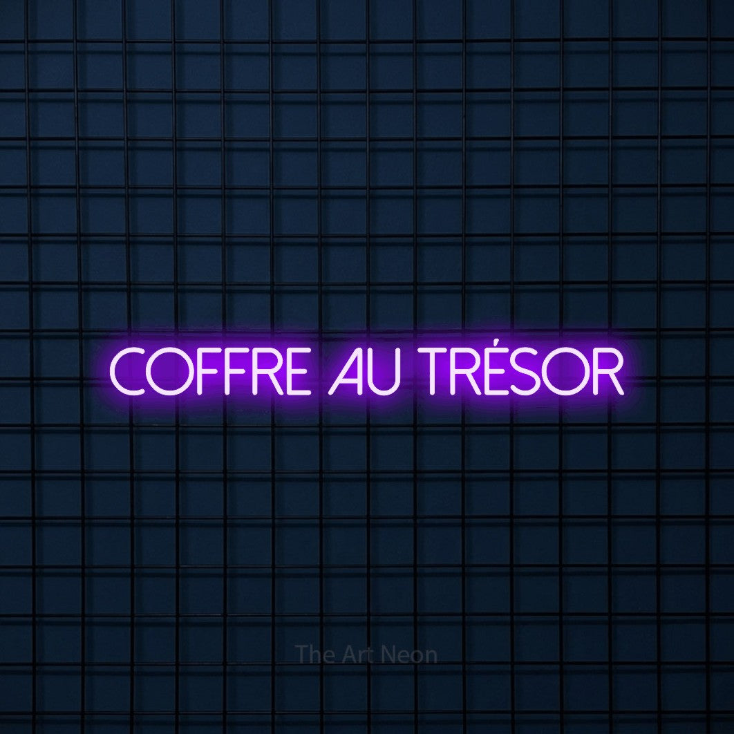 “Coffre au trésor” LED neon sign in purple, with thin sans-serif lettering, shown against a dark blue grid.