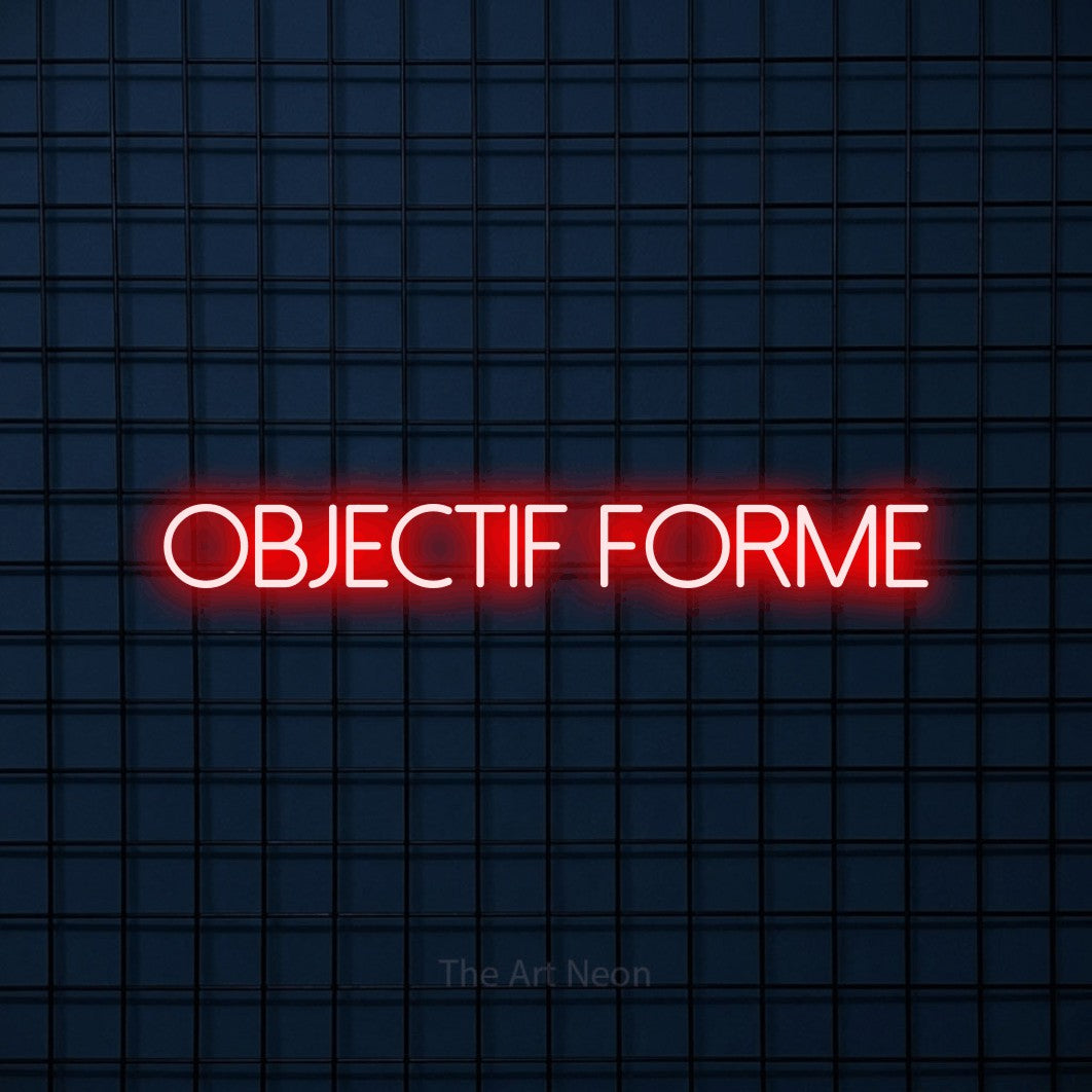 “Objectif forme” LED neon sign in red, with thin sans-serif lettering, shown against a dark blue grid.