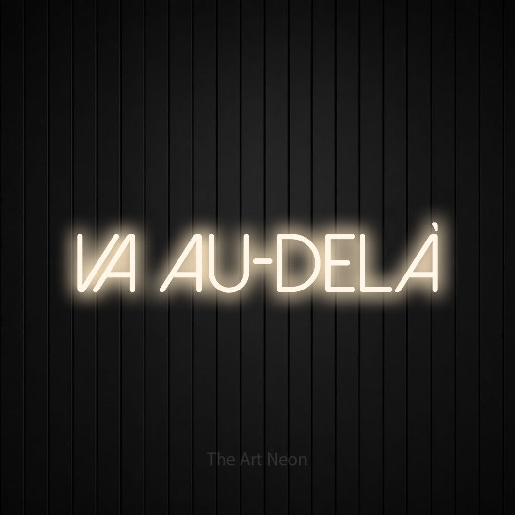 “Va au-delà” LED neon sign in warm white, with thin sans-serif lettering, shown against black vertical wall slats.