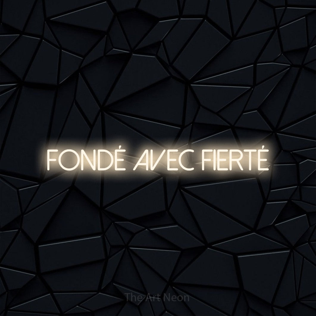 “Fondé avec fierté” LED neon sign in warm white, with thin sans-serif lettering, shown against a black polygonal surface.