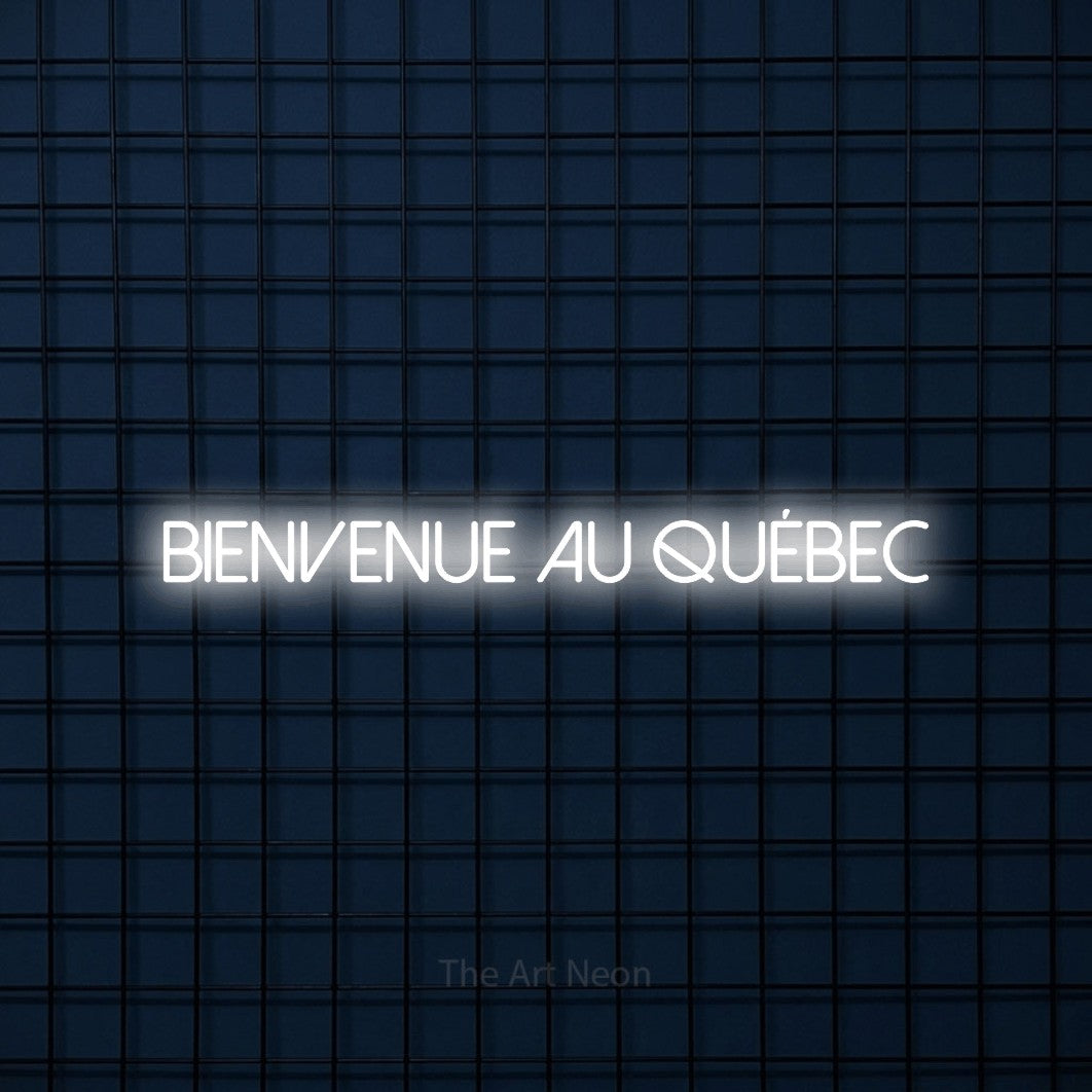 “Bienvenue au Québec” LED neon sign in cool white, with thin sans-serif lettering, shown against a dark blue grid.