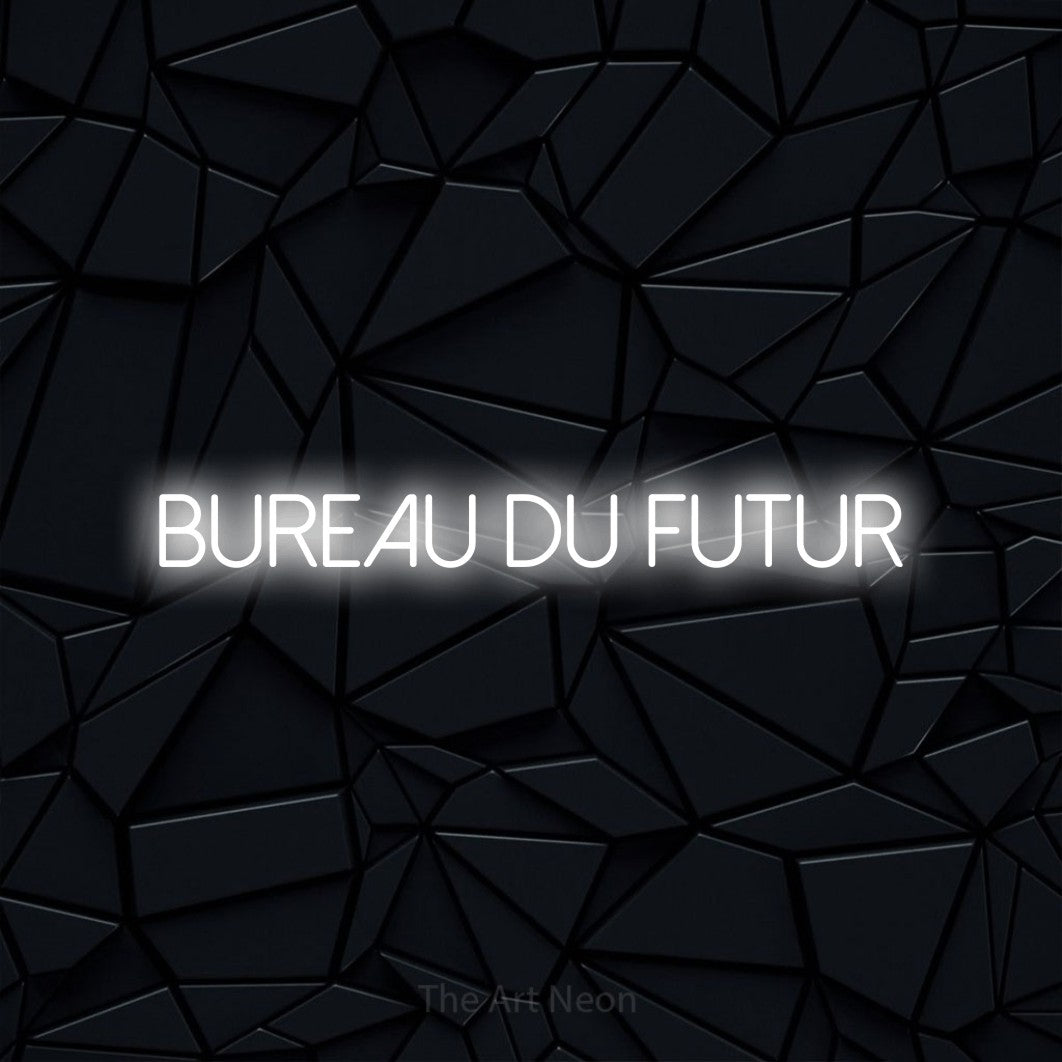 “Bureau du futur” LED neon sign in cool white, with thin sans-serif lettering, shown against a black polygonal surface.