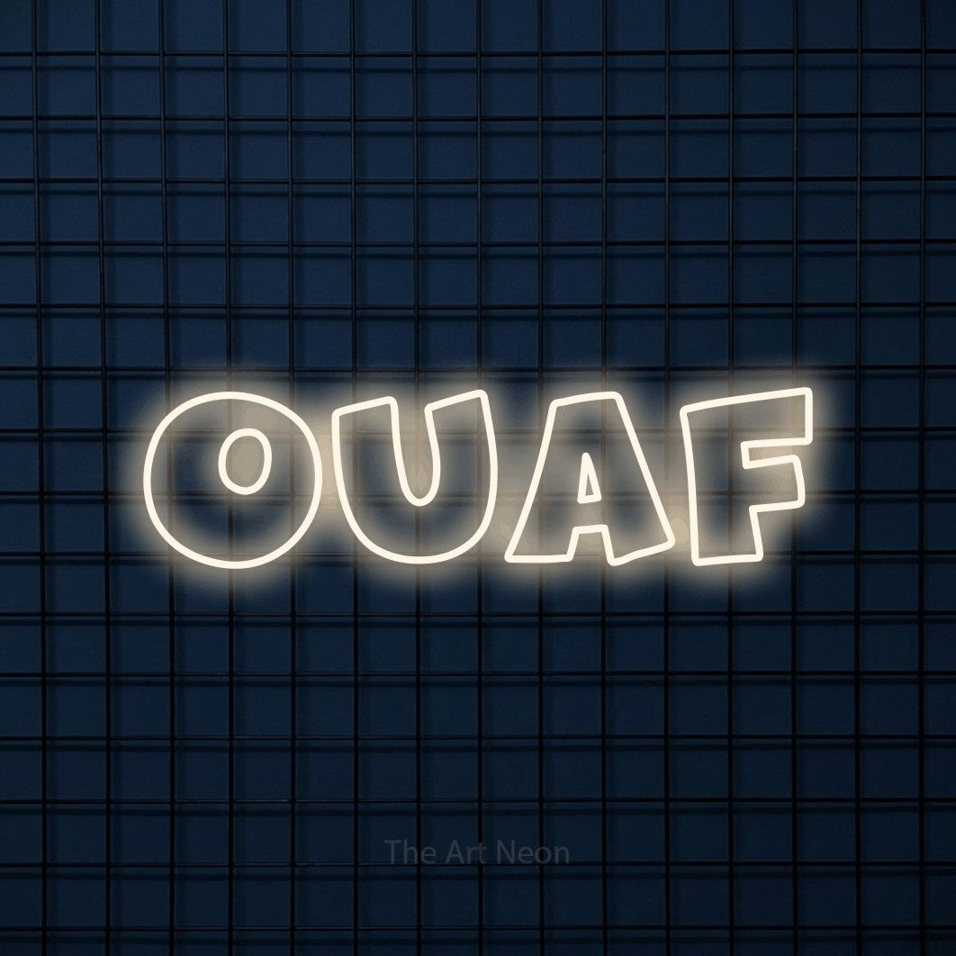 “Ouaf” LED neon sign in warm white, with wide lettering with irregular outlines, shown against a dark blue grid.