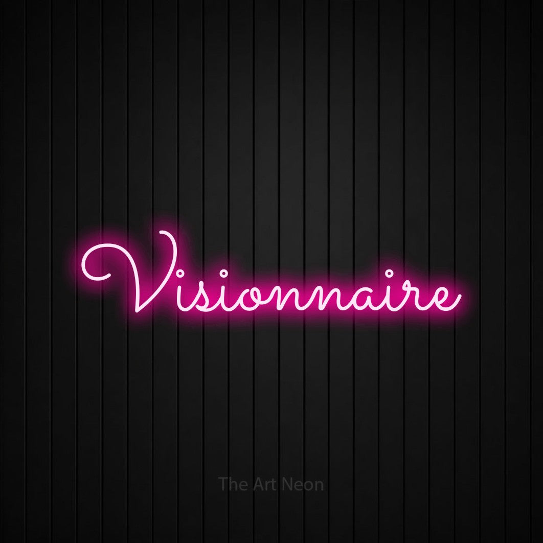 “Visionnaire” LED neon sign in hot pink, with looped cursive lettering, shown against black vertical wall slats.