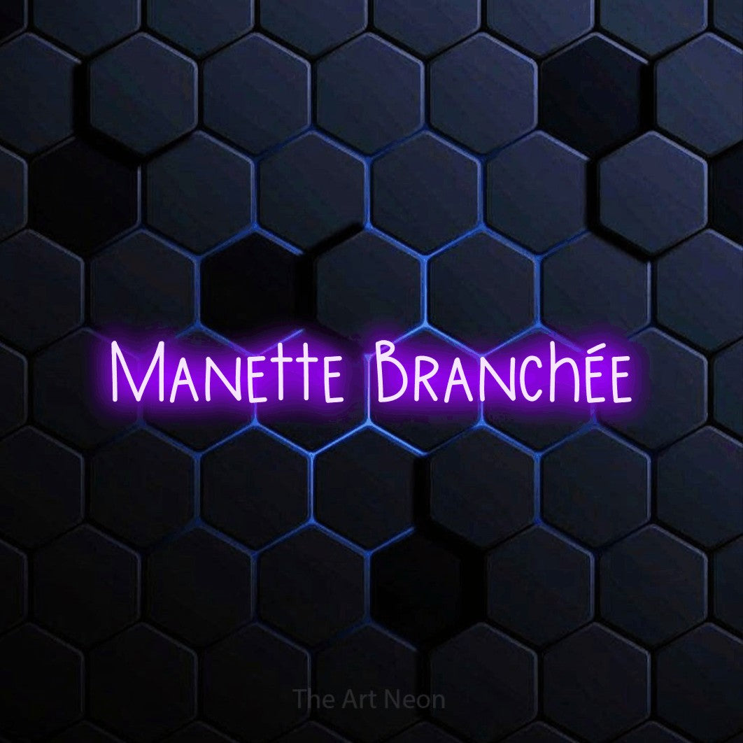 “Manette branchée” LED neon sign in purple, with narrow hand-drawn lettering, shown against a dark blue honeycomb pattern.