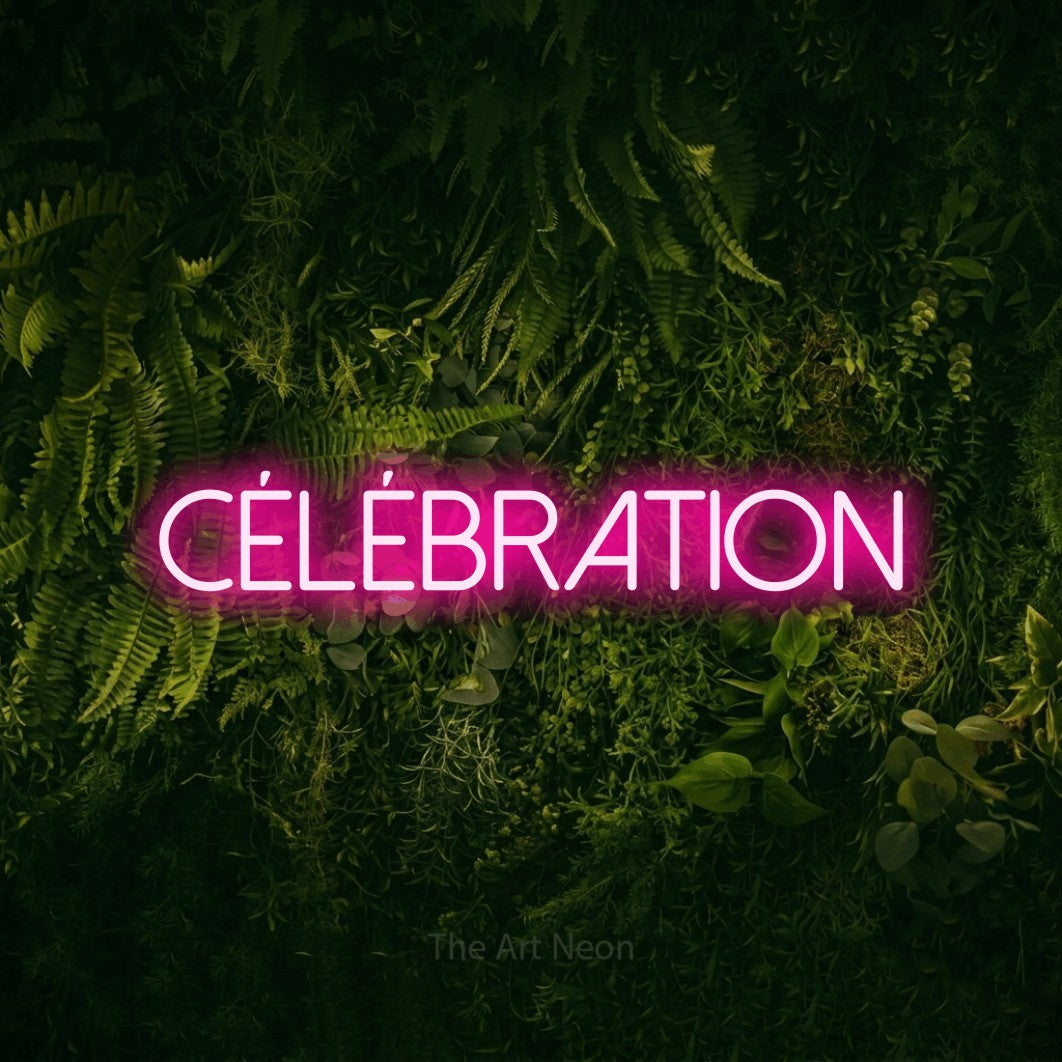 “Célébration” LED neon sign in hot pink, with thin sans-serif lettering, shown against a dark moss and forest backdrop.