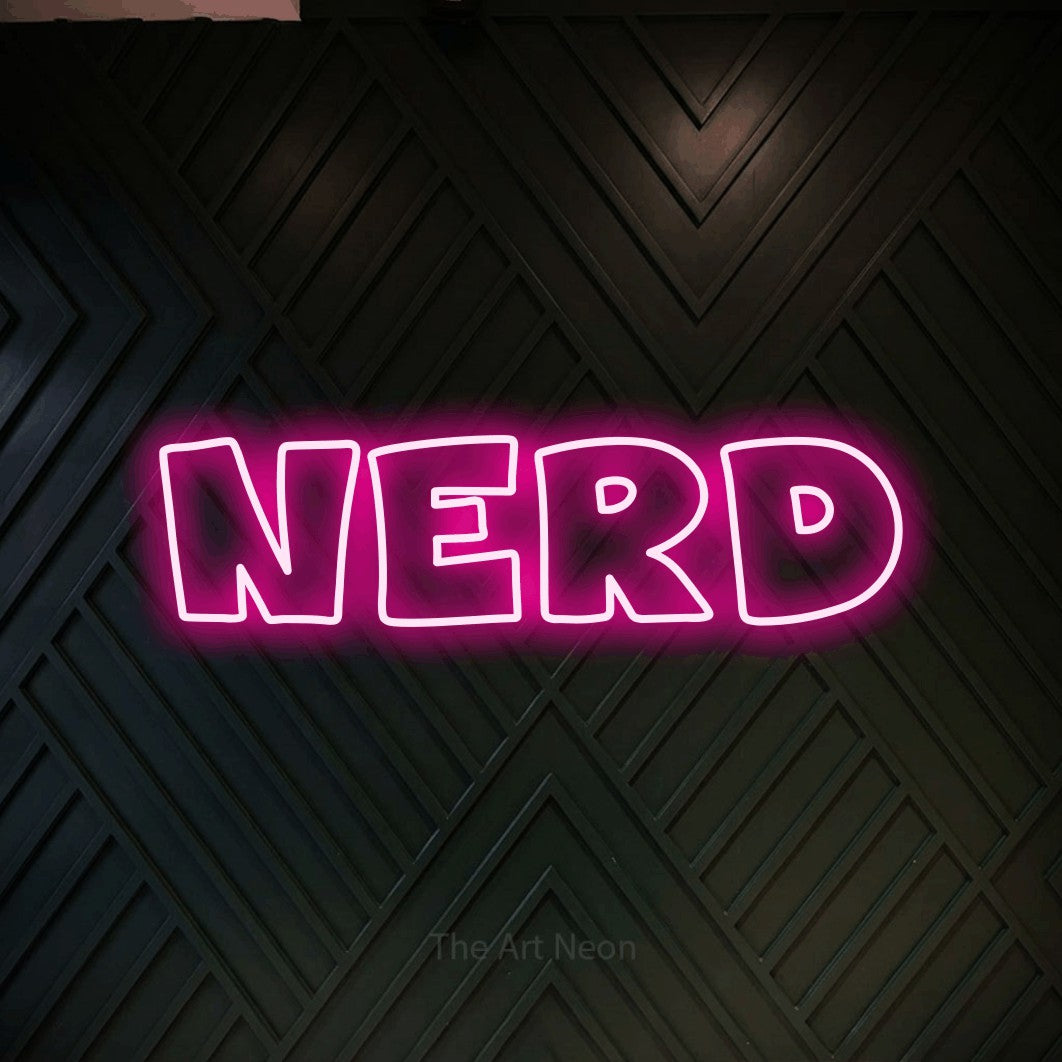 “Nerd” LED neon sign in hot pink, with wide lettering with irregular outlines, shown against a black chevron-patterned wood wall.