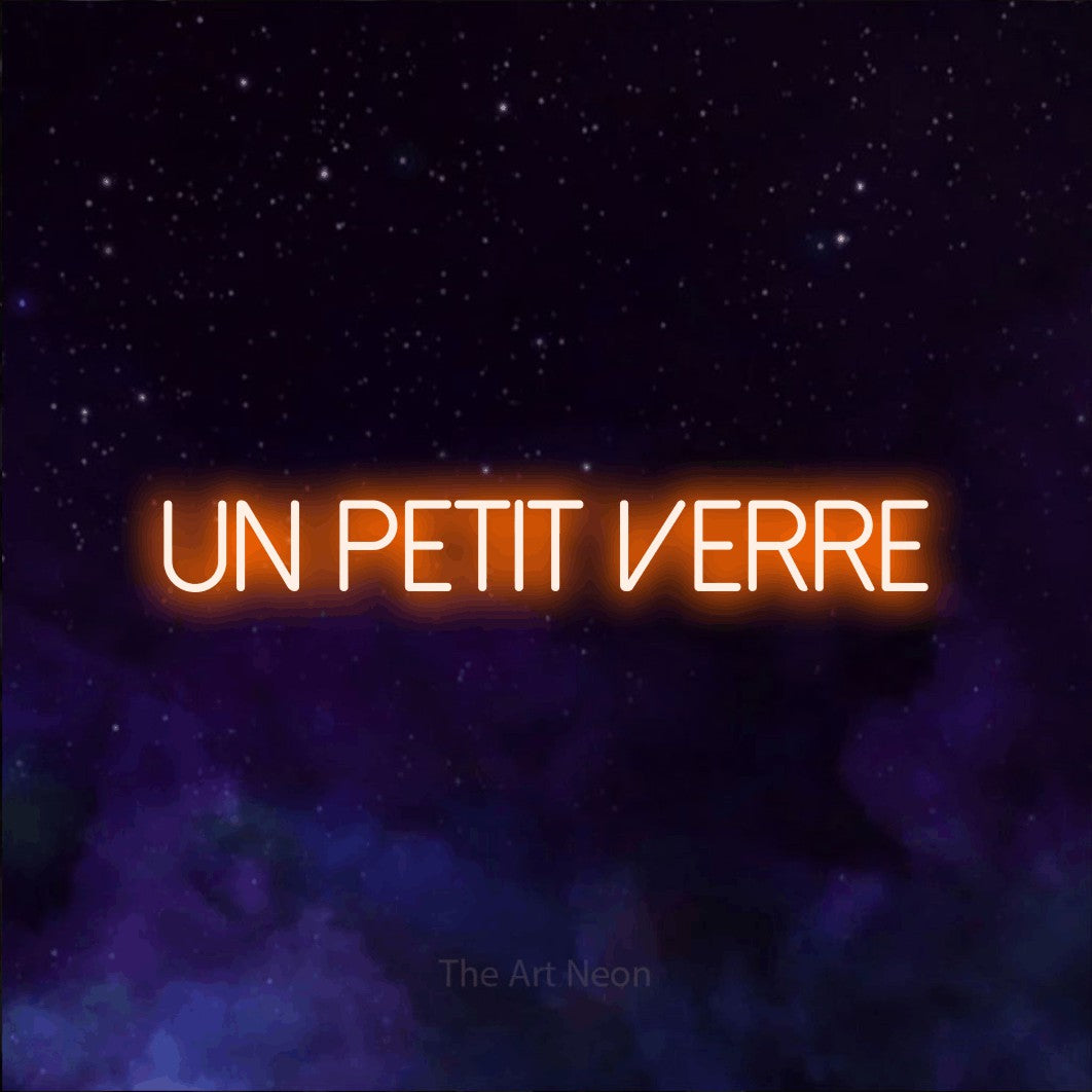 “Un petit verre” LED neon sign in orange, with thin sans-serif lettering, shown against a purple galaxy backdrop.