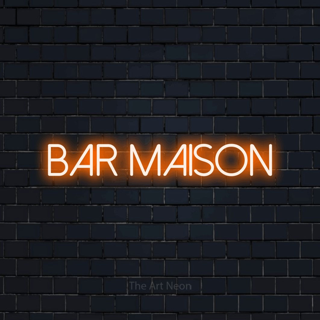 “Bar maison” LED neon sign in orange, with thin sans-serif lettering, shown against a dark navy brick wall.