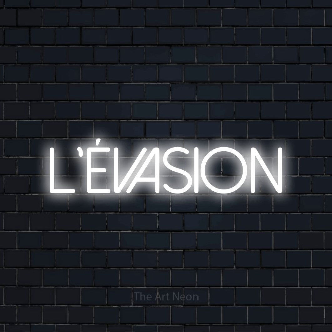 “L'évasion” LED neon sign in cool white, with thin sans-serif lettering, shown against a dark navy brick wall.