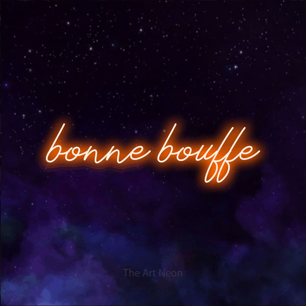 “Bonne bouffe” LED neon sign in orange, with cursive lettering, shown against a purple galaxy backdrop.