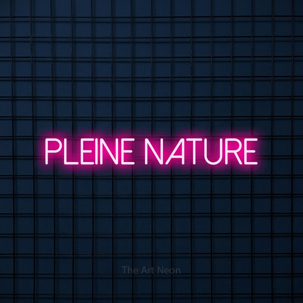 “Pleine nature” LED neon sign in hot pink, with thin sans-serif lettering, shown against a dark blue grid.