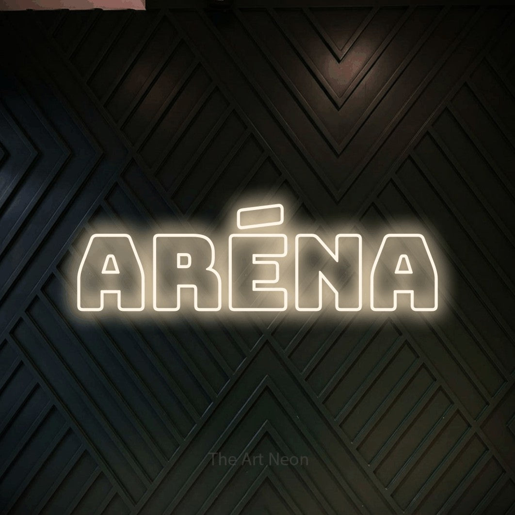 “Aréna” LED neon sign in warm white, with bold outline lettering, shown against a black chevron-patterned wood wall.