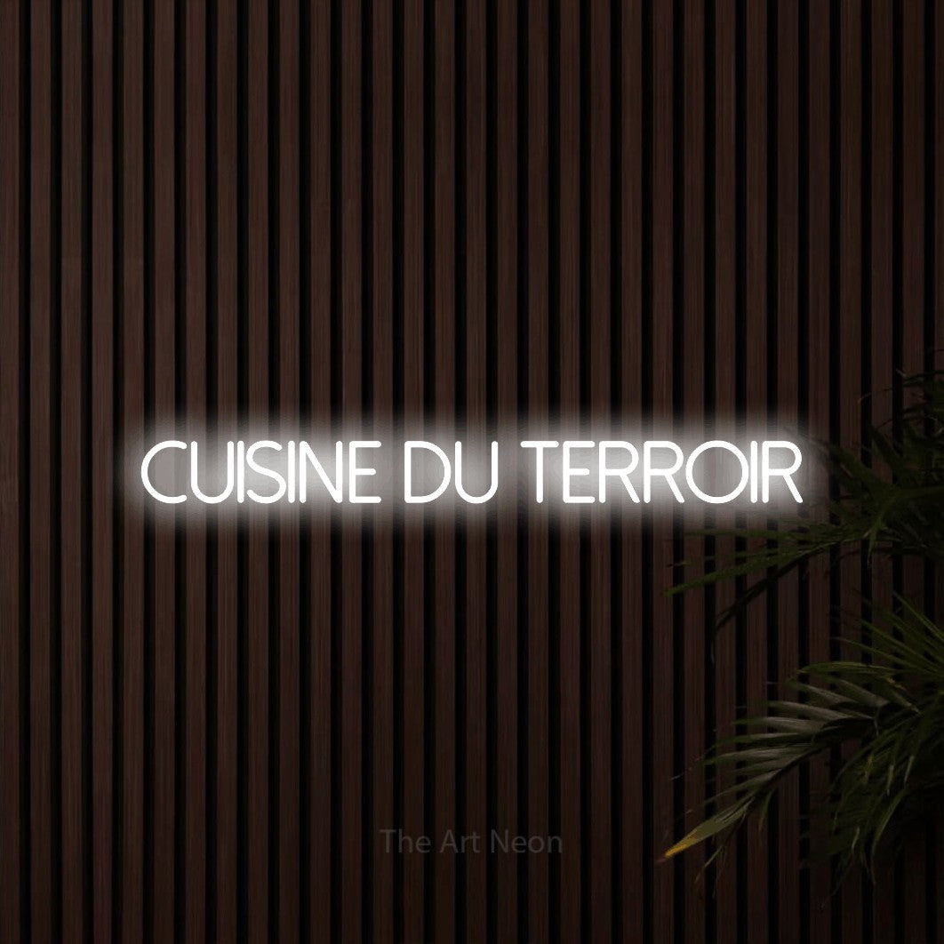 “Cuisine du terroir” LED neon sign in cool white, with thin sans-serif lettering, shown against dark wooden wall slats.