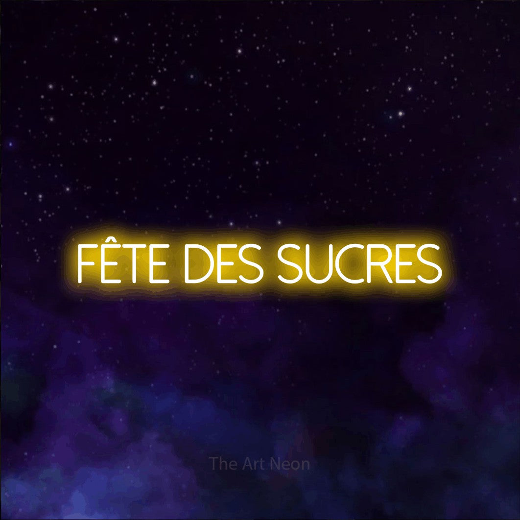 “Fête des sucres” LED neon sign in yellow, with thin sans-serif lettering, shown against a purple galaxy backdrop.